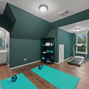 Spacious multi-functional room featuring a home gym setup, ideal for fitness enthusiasts and wellness activities.