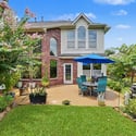 Enjoy outdoor living in this landscaped backyard, perfect for gatherings or quiet moments.
