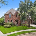 Beautifully landscaped home featuring a spacious layout, perfect for comfortable family living in a desirable neighborhood.