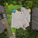 Spacious home with lush backyard, offering ample outdoor space and convenient access to nearby amenities.