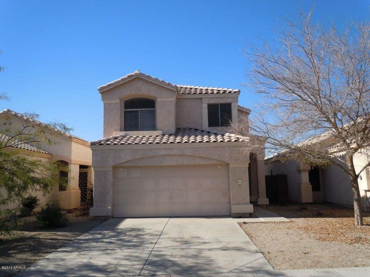 1 of 22. Beautiful Glendale home featuring a private driveway, attached 2-car garage, and classic tile roof architecture. Situated within a gated community offering a community pool and convenient access to local amenities.