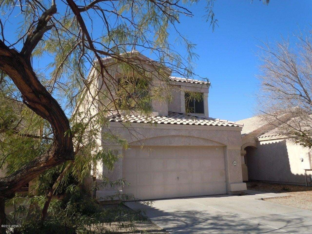 3 of 22. Side-angle exterior view highlighting mature landscaping, attractive curb appeal, and a desirable cul-de-sac location. This Glendale property offers privacy, comfort, and community amenities.
