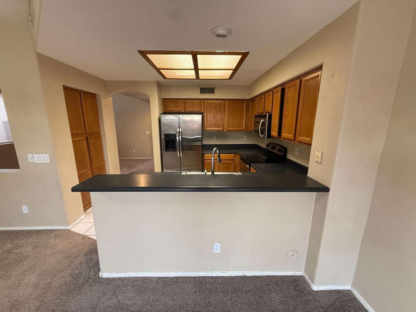 9 of 22. Well-equipped kitchen with stainless steel appliances, abundant cabinet storage, and an efficient layout. Perfect for cooking, organization, and daily convenience.
