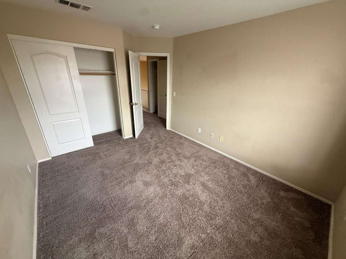 17 of 22. Well-sized bedroom featuring neutral finishes, soft carpeting, and a spacious closet. Designed to provide comfort and functionality for everyday living.