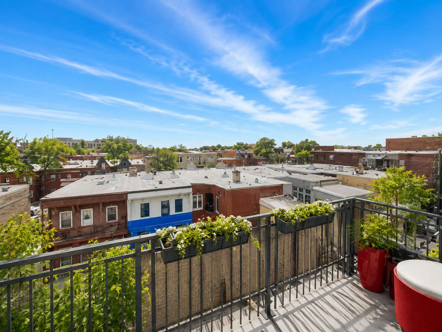 19 of 21. Enjoy expansive city views from this inviting balcony, perfect for relaxing or entertaining.
