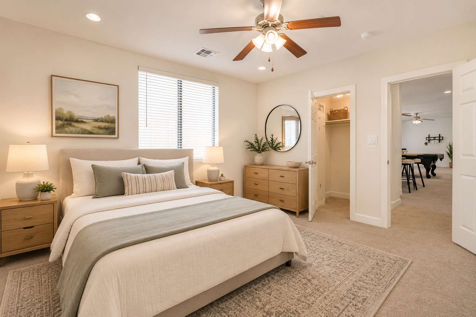 52 of 72. Virtually staged to inspire, this basement bedroom showcases generous proportions, soft carpeting, ceiling fan, walk-in closet, and comfortable guest accommodations within this Scottsdale home.