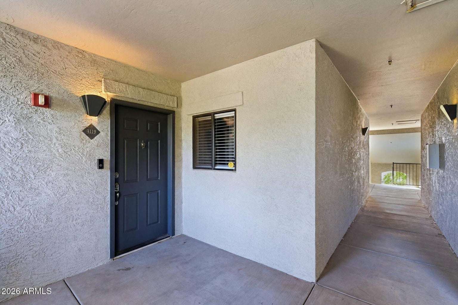 2 of 32. The covered front entrance welcomes you into this well-maintained condominium while offering privacy and convenient access. Beautifully maintained walkways reflect the quality of the Scottsdale Signature community.