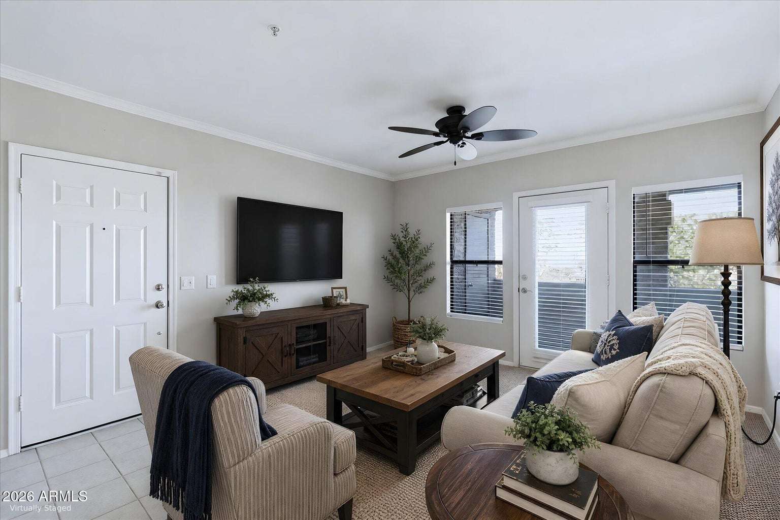 3 of 32. Virtually staged to showcase the possibilities, this bright living room features abundant natural light, neutral d cor, and private balcony access, creating an inviting space for relaxing or entertaining.