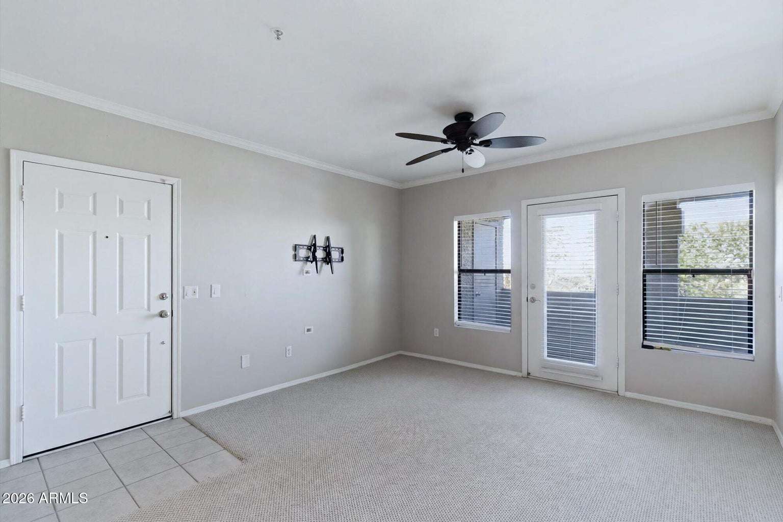 4 of 32. Bright windows, neutral finishes, and direct balcony access create an airy living space ready for your personal style. The open layout enhances both comfort and functionality.