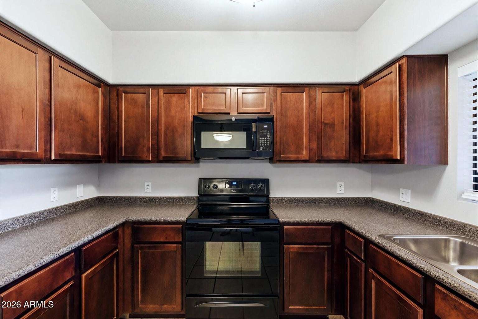 14 of 32. Featuring extensive cabinet storage, durable countertops, updated appliances, and an efficient layout, this kitchen offers the perfect combination of style and everyday functionality.
