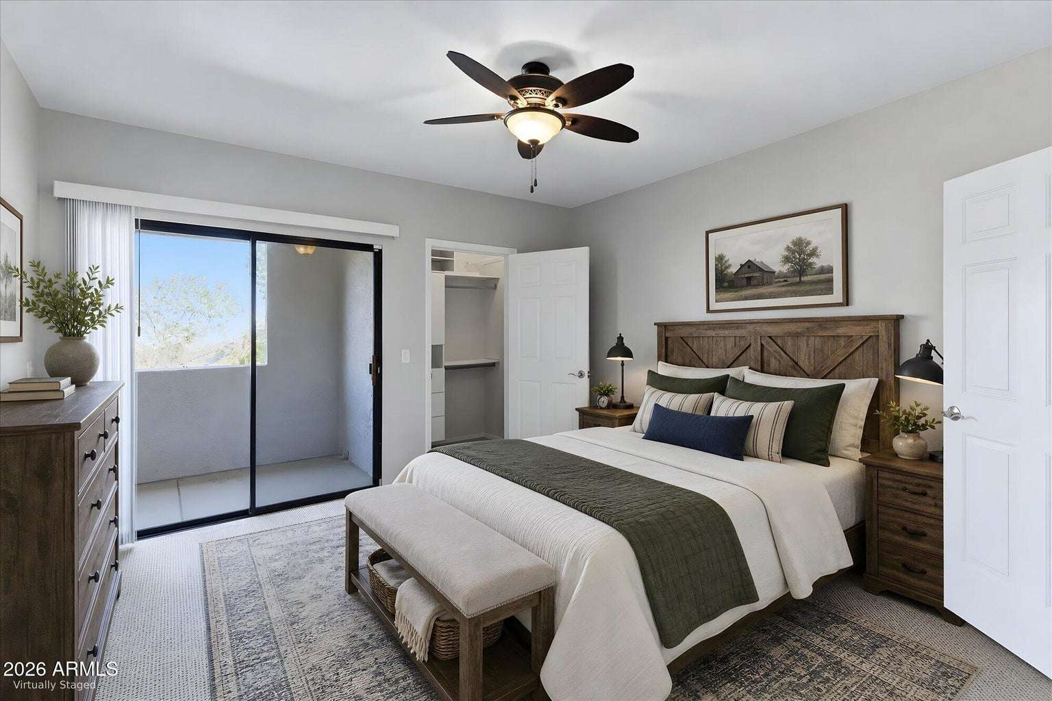 16 of 32. Virtually staged to inspire, this spacious primary bedroom features a private balcony, walk-in closet with built-in organization, and a calming atmosphere designed for rest and relaxation.