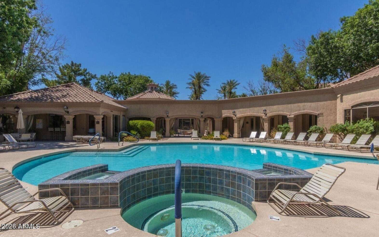 31 of 32. The spacious community pool and spa create the perfect place to relax and unwind, surrounded by professionally maintained landscaping, shaded gathering areas, and resort-style amenities in this desirable Scottsdale community.