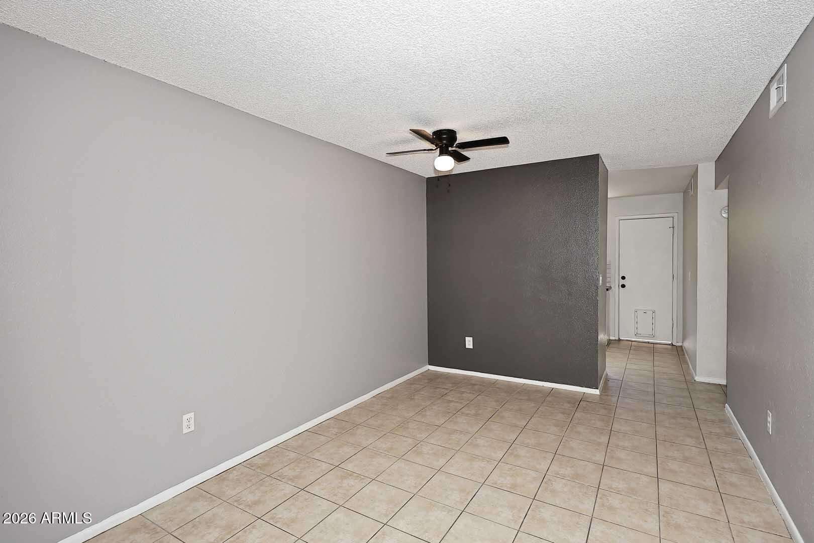5 of 29. Open-concept design creates an airy atmosphere with durable tile flooring and modern paint tones. The flowing layout makes daily living and entertaining effortless.