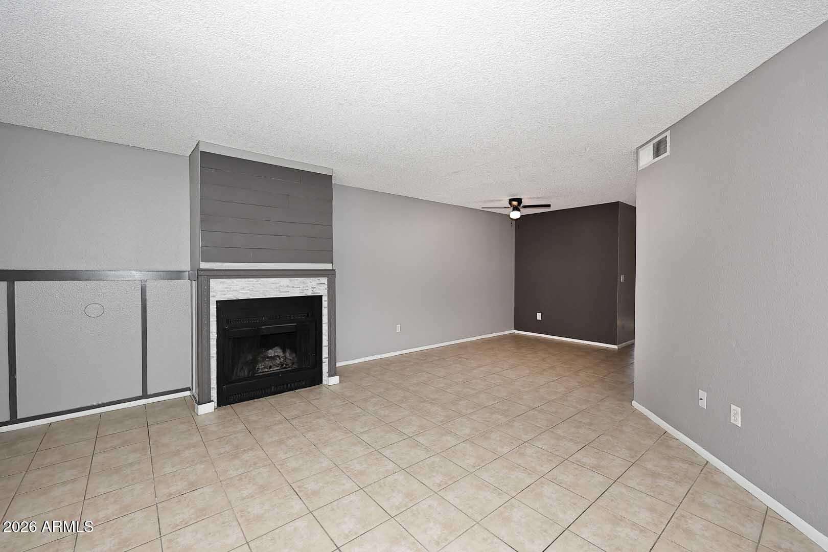 9 of 29. Open living and dining space with a stylish fireplace and excellent flow between rooms. Perfect for entertaining while maintaining a comfortable everyday living environment.