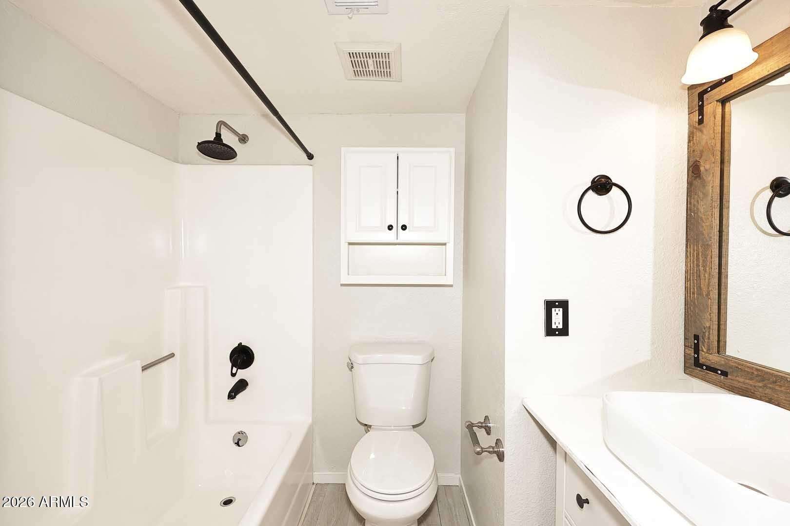16 of 29. Updated bathroom featuring a modern vanity, stylish vessel sink, and refreshed finishes throughout. Thoughtful upgrades provide both functionality and visual appeal.