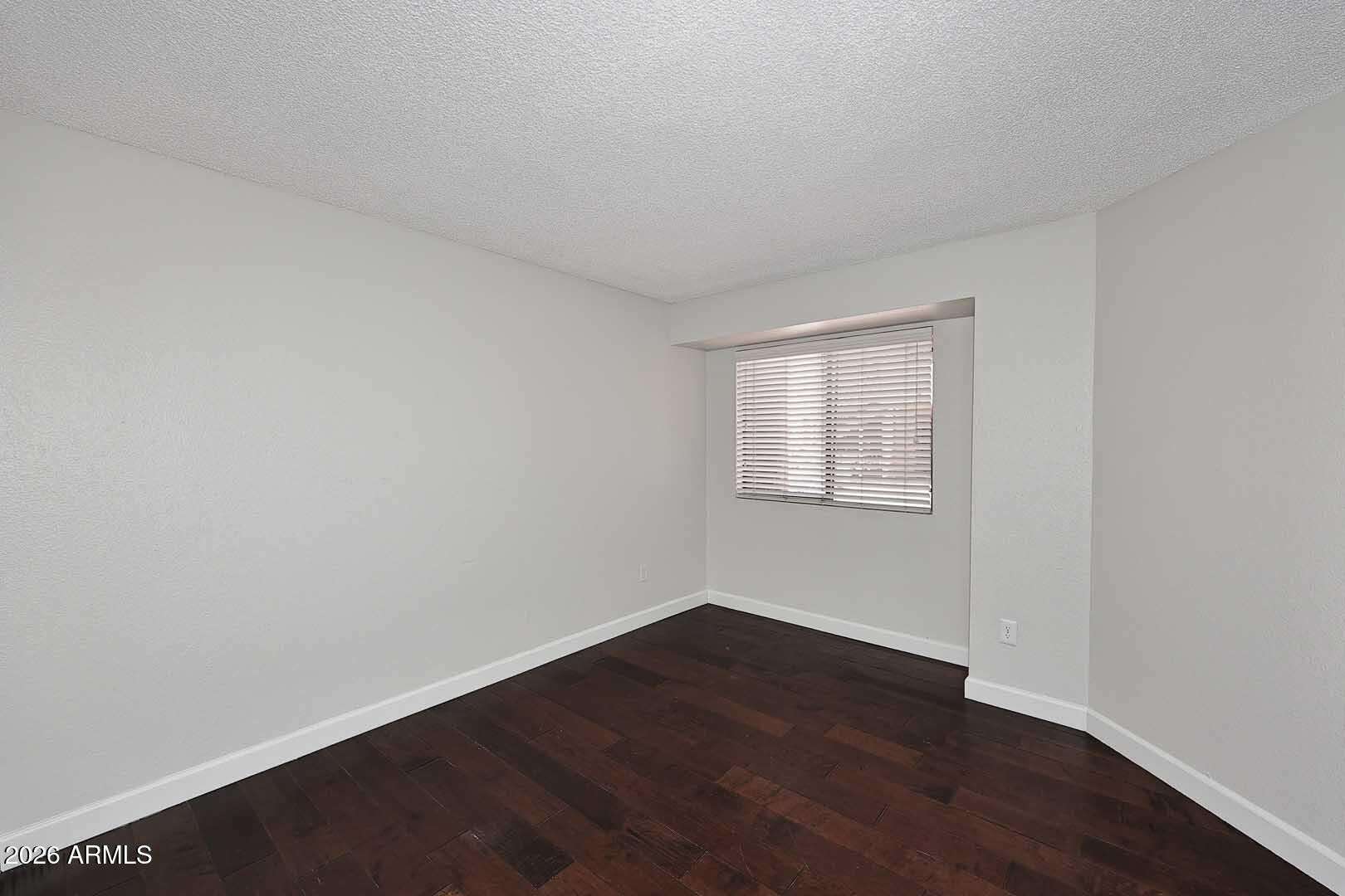19 of 29. Secondary bedroom with updated flooring, neutral finishes, and a comfortable layout. Perfect for guests, a home office, workout room, or hobby space.
