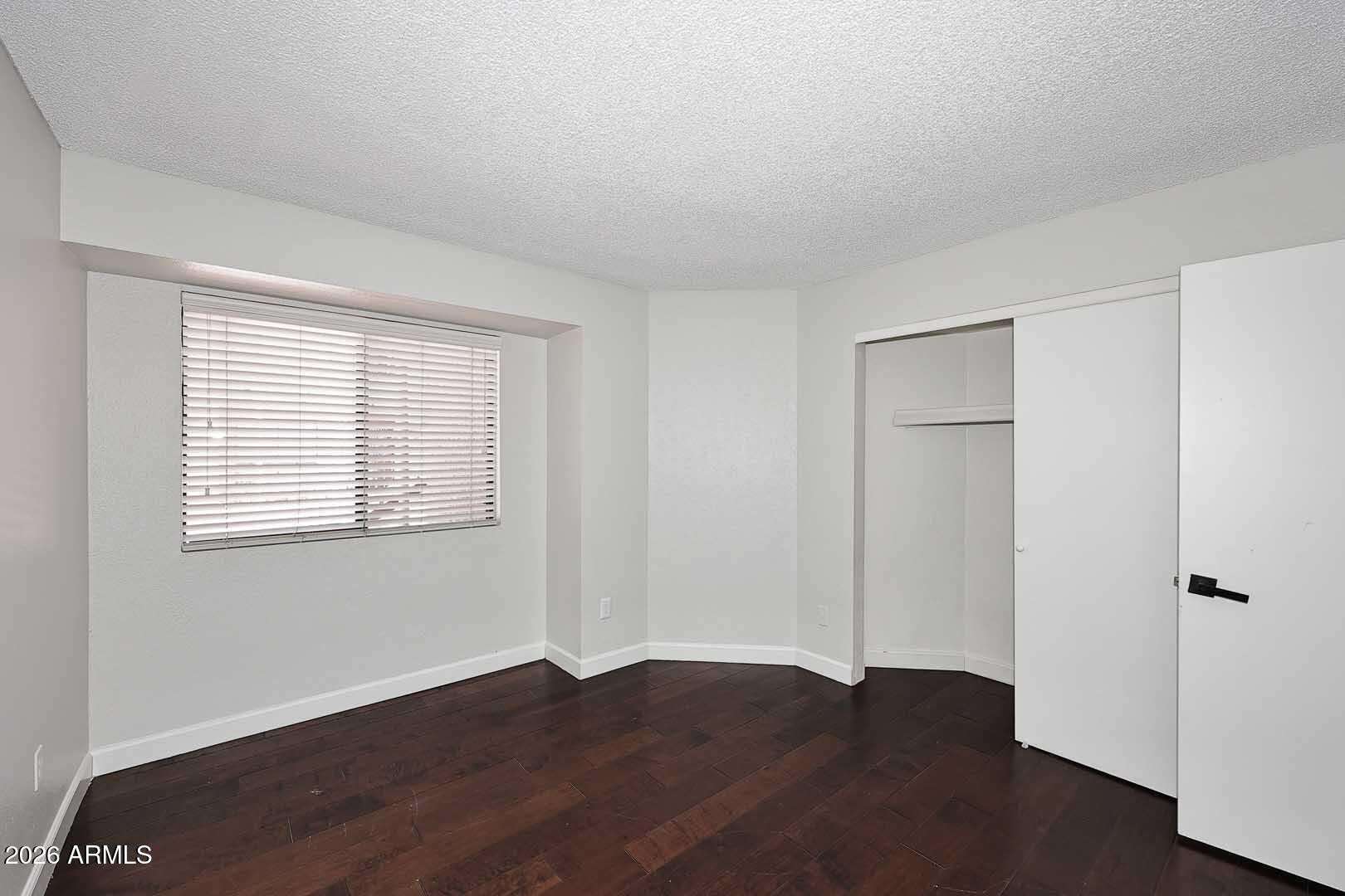 20 of 29. Bright guest bedroom featuring generous closet space, natural light, and attractive flooring. This versatile room offers comfort and flexibility for a variety of lifestyle needs.