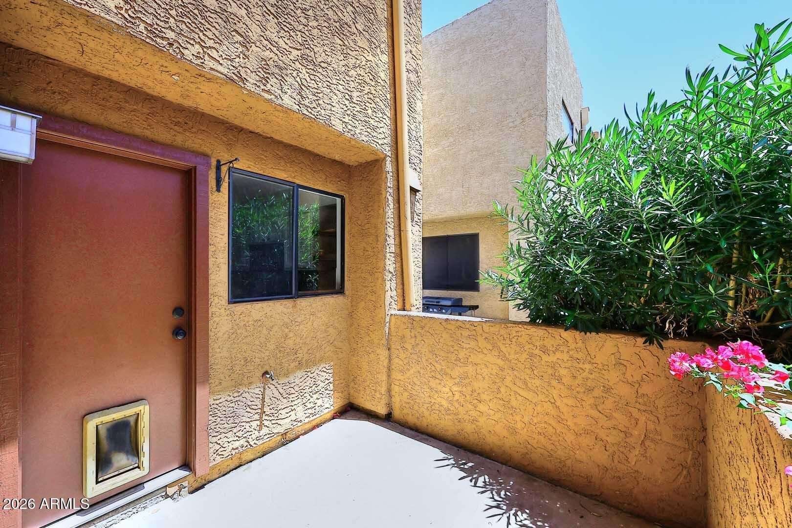 24 of 29. Attractive patio area featuring privacy, mature greenery, and convenient access to indoor living areas. A wonderful extension of the home's usable living space.