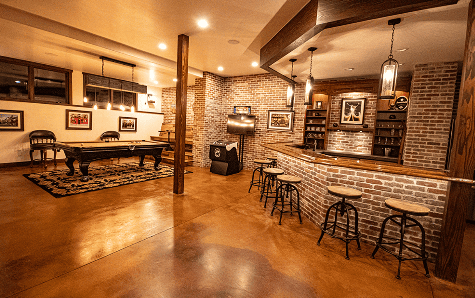27 of 42. Spacious entertainment area featuring a custom bar, billiards, and unique textured finishes throughout.