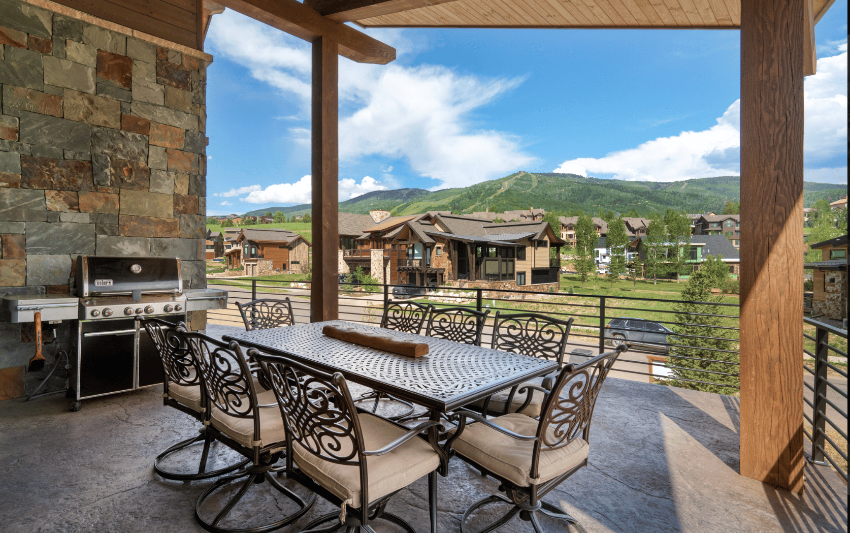 3 of 42. Spacious outdoor dining area with gourmet gas grill and ski mountain views.