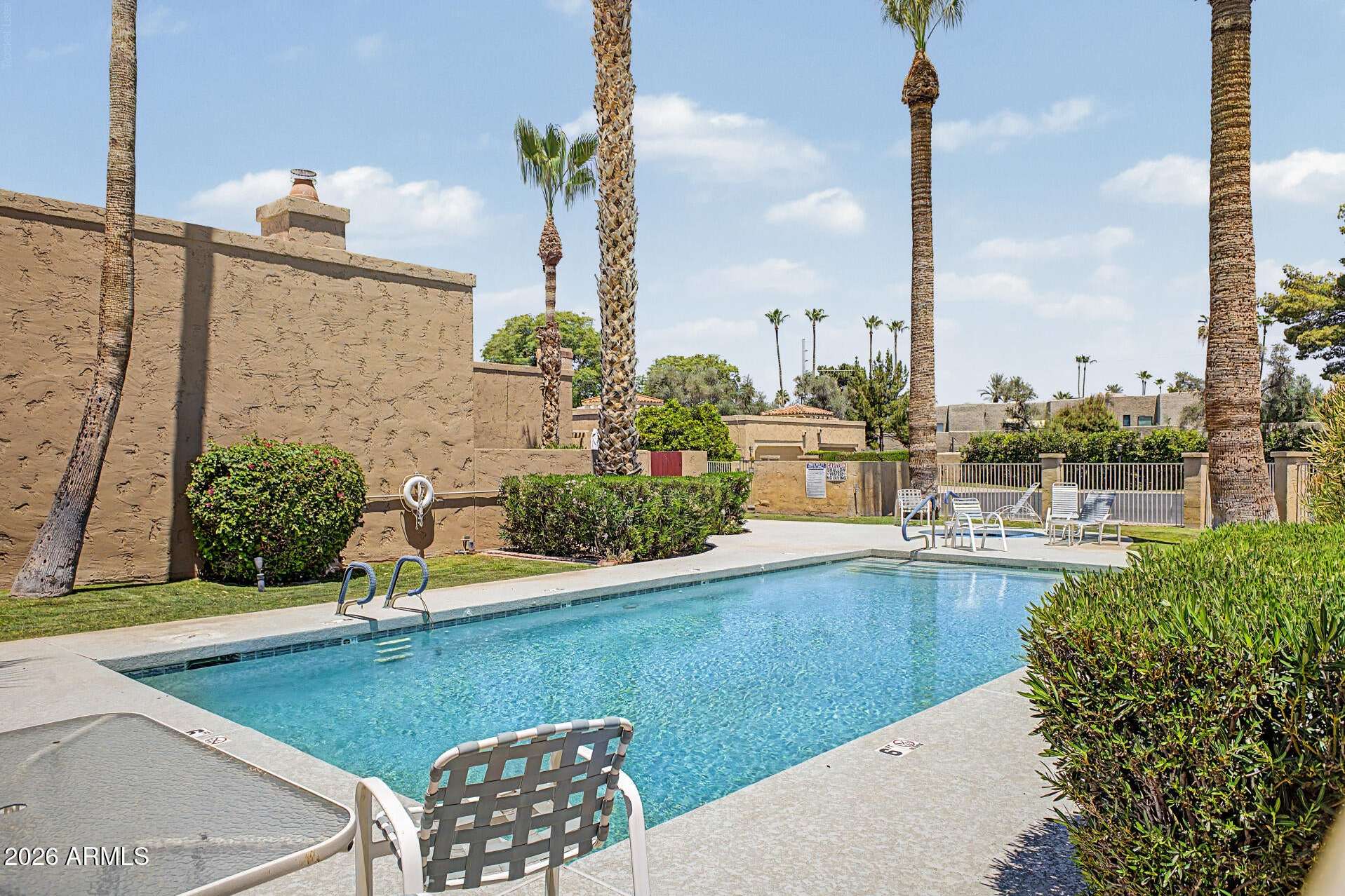 30 of 30. Well-maintained community pool surrounded by lush landscaping, lounge seating, and sunny gathering areas. A standout feature that adds comfort and convenience to everyday Scottsdale living.