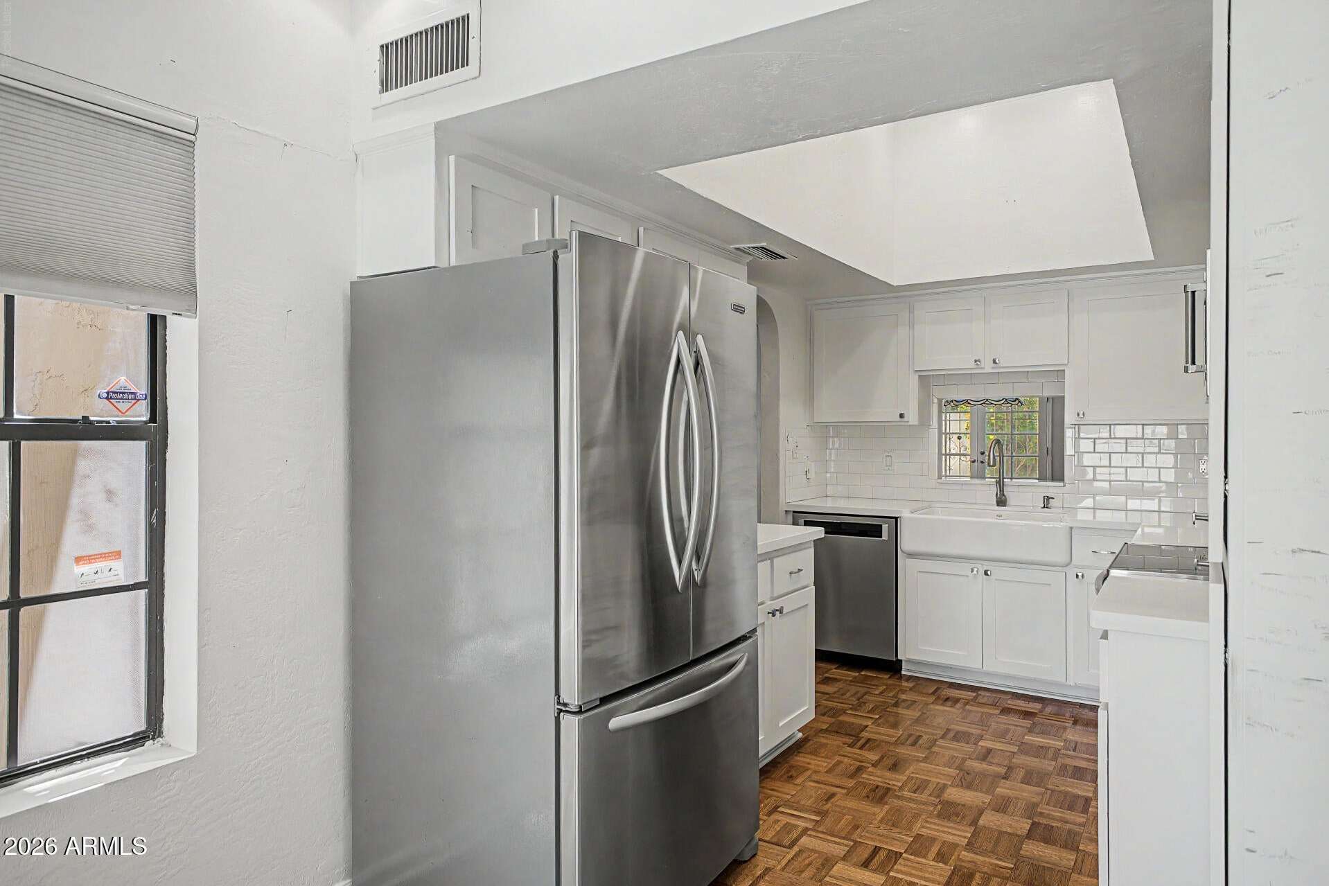 6 of 30. Spacious kitchen with updated appliances, ample storage, and generous counter space for meal preparation. The efficient layout supports both everyday living and entertaining needs.
