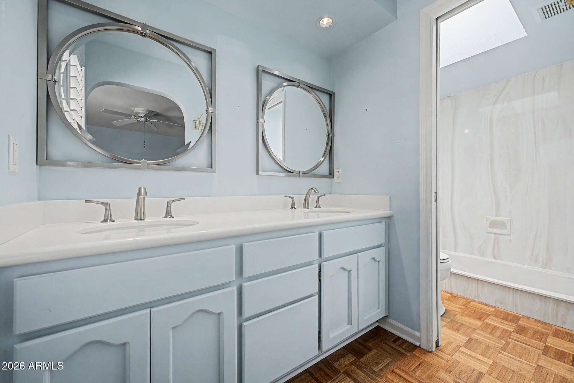 15 of 30. Spacious vanity area with dual sinks, generous countertop space, and stylish mirrors. Designed for convenience, this area supports a functional and organized daily routine.