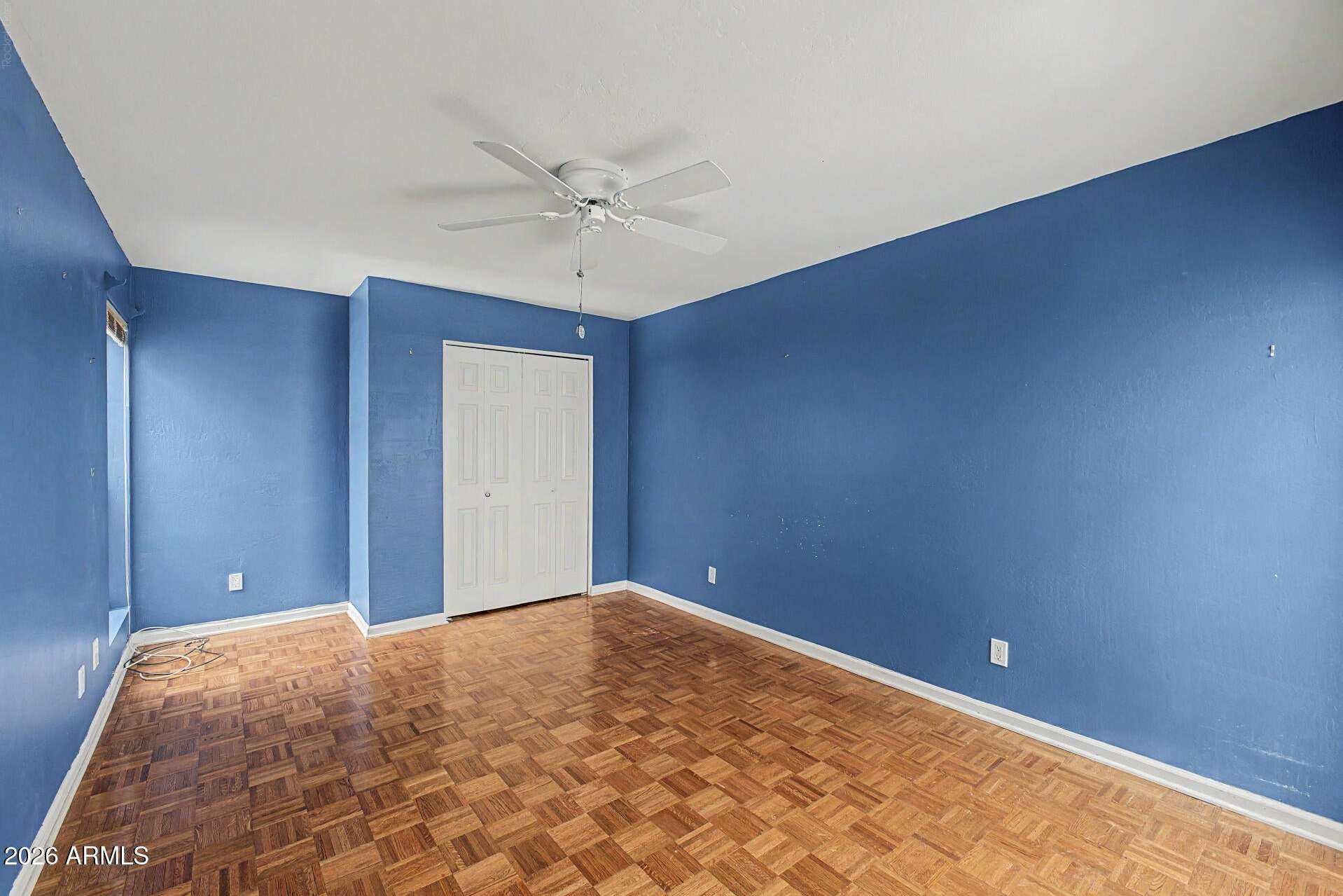 17 of 30. Secondary bedroom offering excellent versatility for guests, remote work, fitness equipment, or hobbies. Natural light and ceiling fan comfort enhance the space.