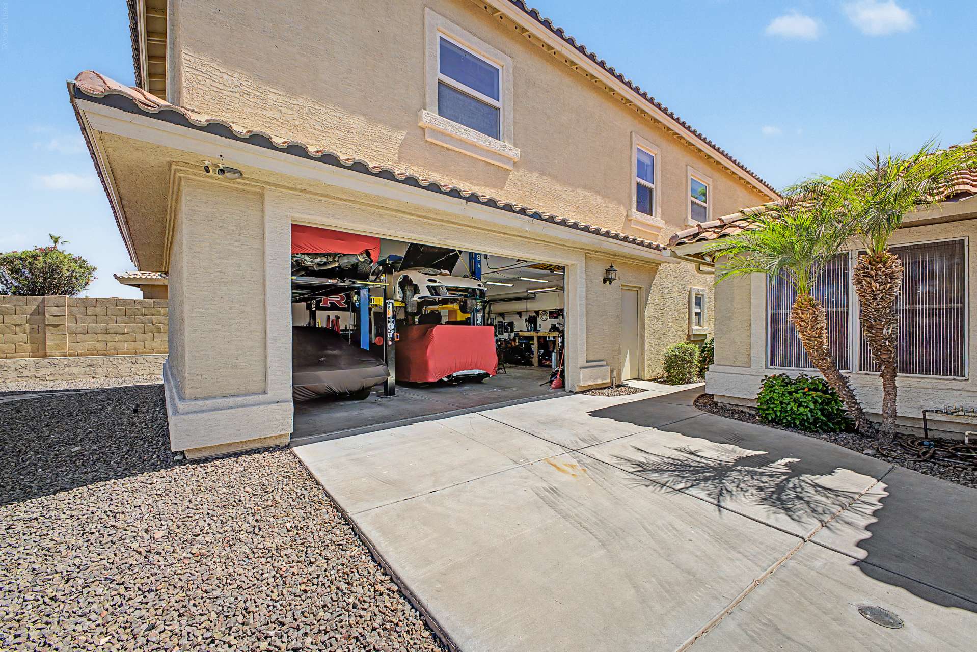 16 of 47. A rare garage setup with room for multiple vehicles, professional lifts, workshop space, and impressive ceiling height. This exceptional feature makes the home ideal for collectors, hobbyists, or anyone seeking unmatched garage versatility.