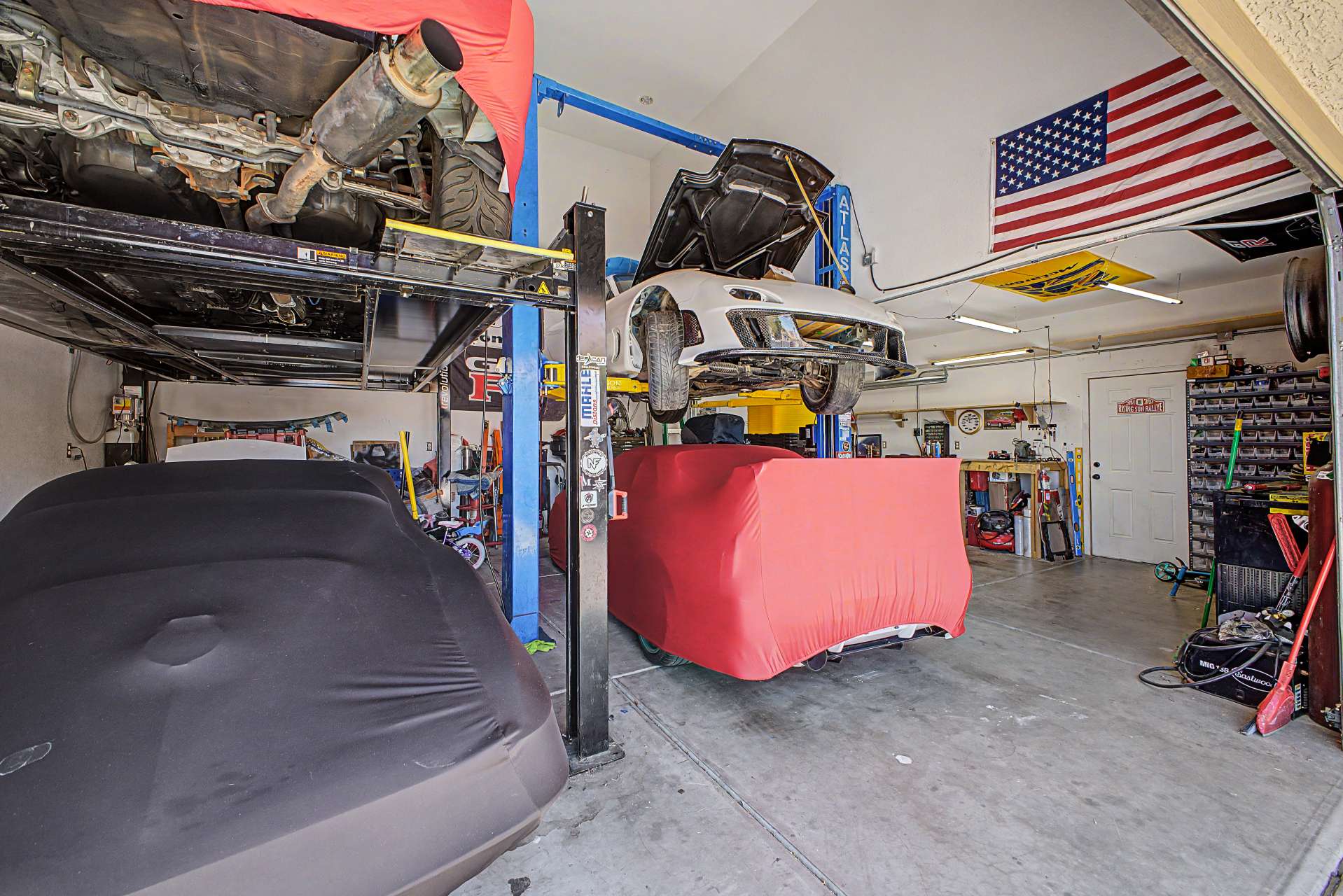 17 of 47. Designed for automotive enthusiasts, this oversized garage features lift-ready ceilings, extensive workspace, and ample room for vehicles, tools, and projects while providing incredible storage flexibility.