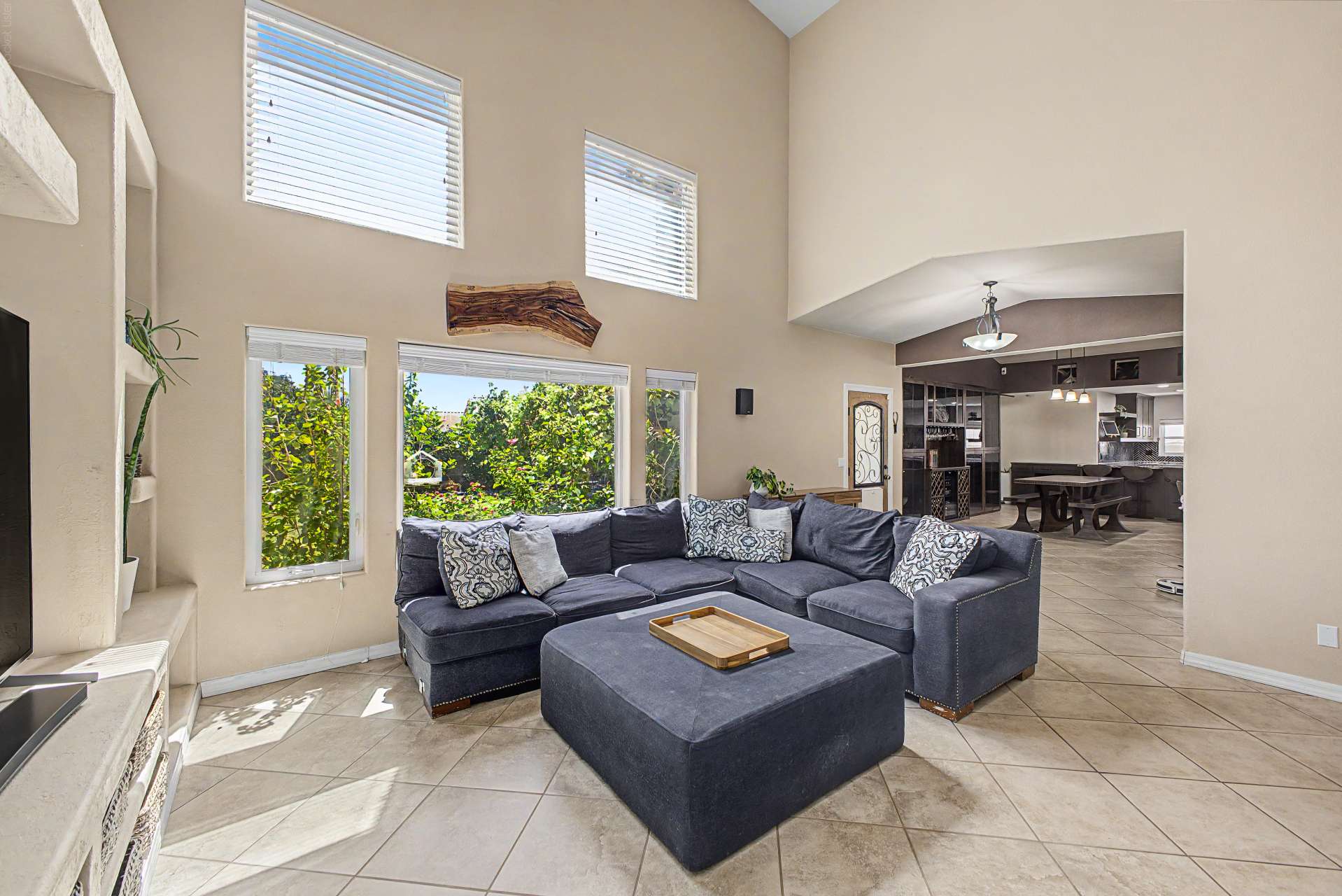 23 of 47. The spacious family room features impressive architectural details, abundant natural light, custom built-ins, and an open flow into the heart of the home, creating a comfortable gathering place for every occasion.