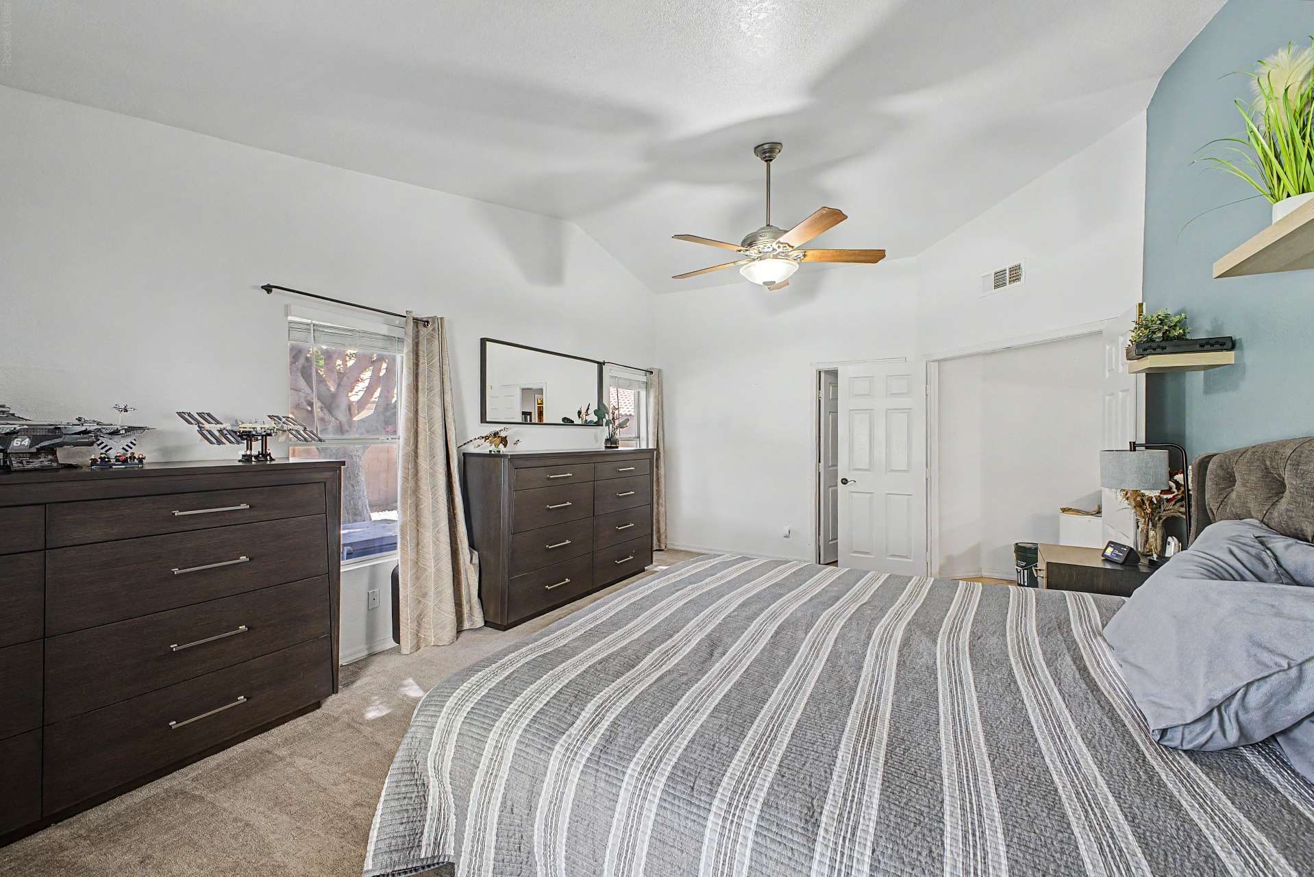 31 of 47. Featuring vaulted ceilings, soft carpeting, abundant natural light, and an open layout, this spacious bedroom creates a welcoming retreat with room to personalize your own private sanctuary.