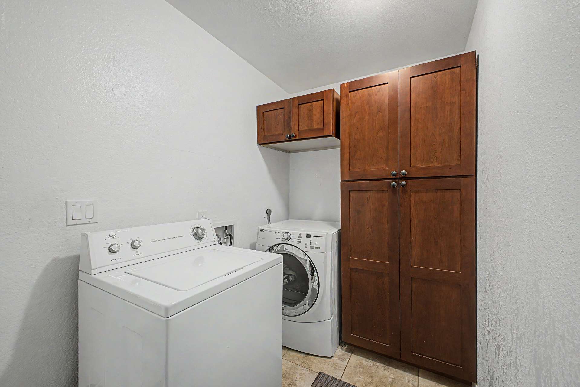 42 of 47. The dedicated laundry area features built-in cabinetry, washer and dryer hookups, and extra storage to help keep daily routines organized and efficient.