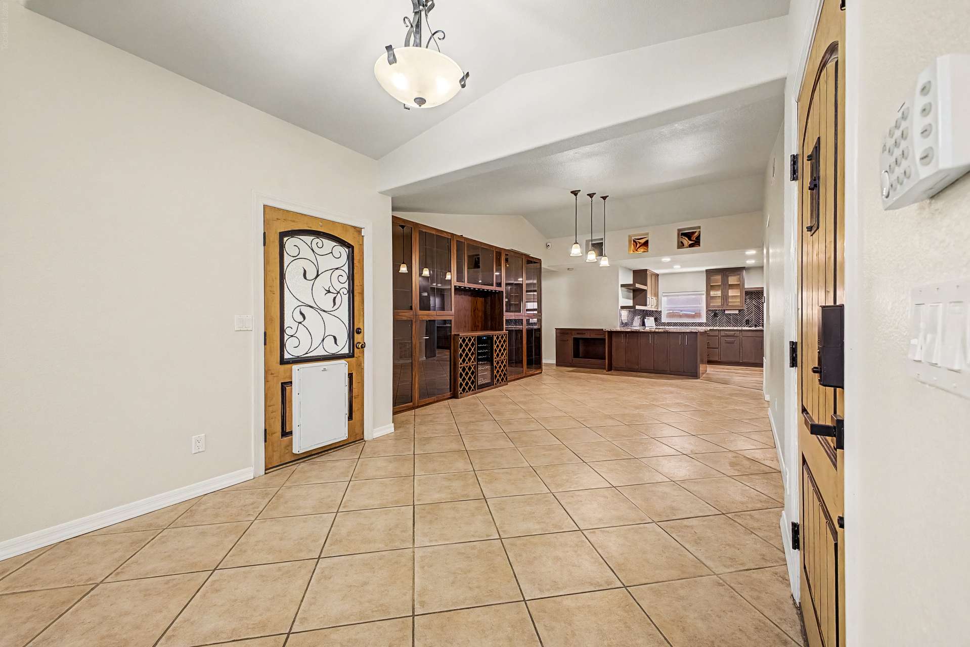 3 of 47. Enjoy effortless entertaining with an open-concept design connecting the living room, custom built-in cabinetry, and beautifully remodeled kitchen filled with premium finishes and modern style.