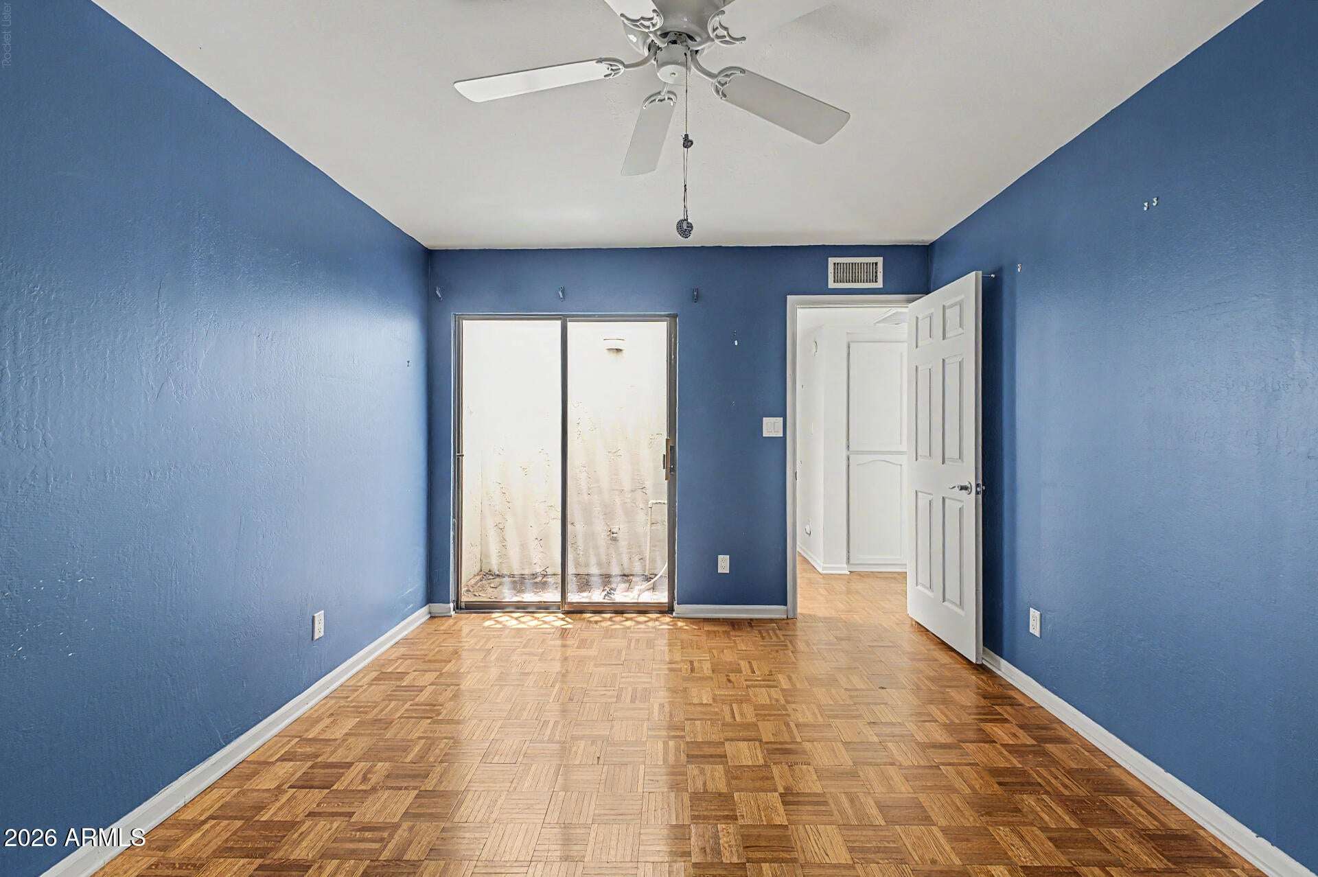 18 of 30. Well-sized bedroom with parquet flooring, ceiling fan, and bright natural light. This adaptable room adds flexibility to accommodate changing lifestyle needs.