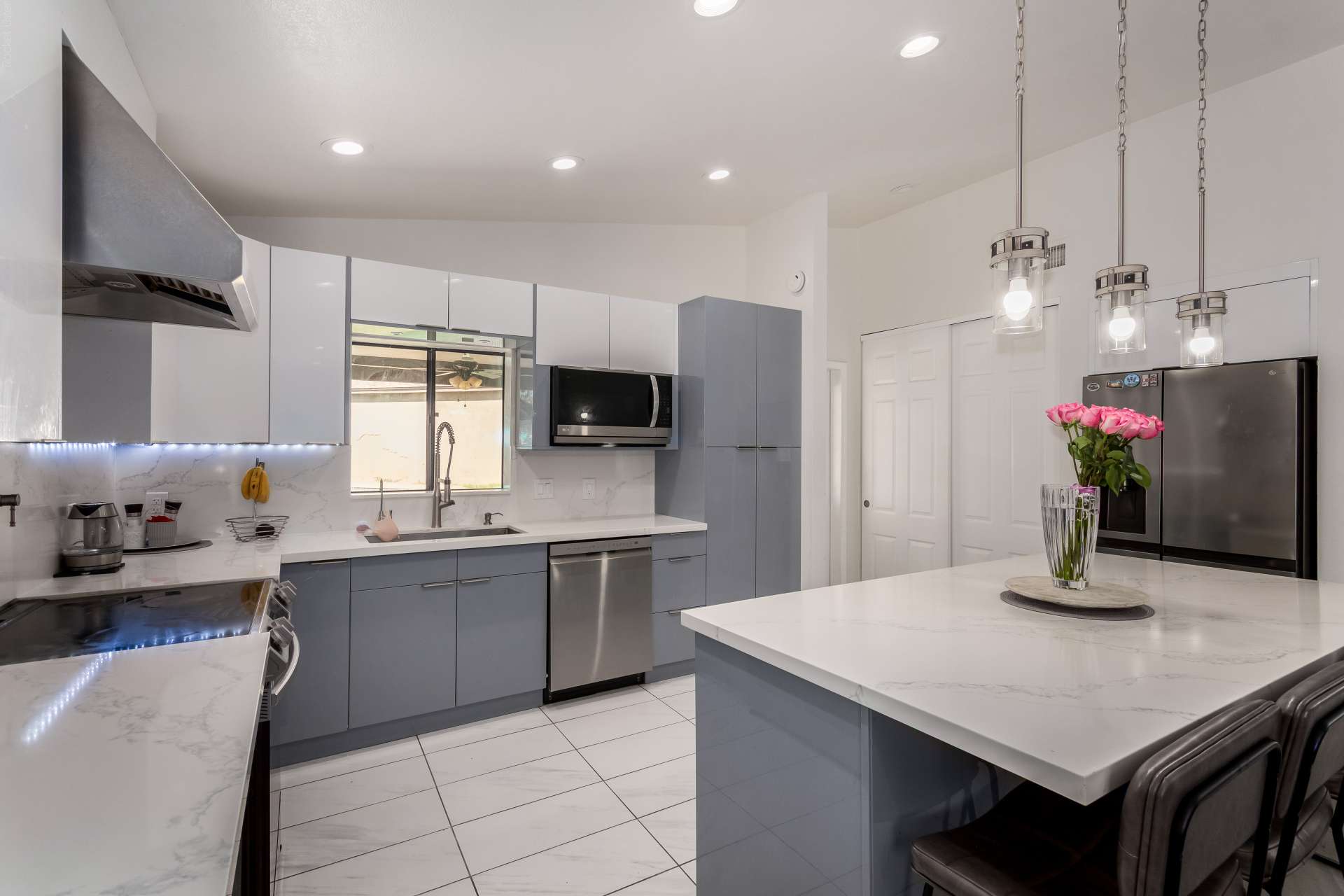 7 of 34. Featuring generous workspace, a large island, stylish cabinetry, and premium finishes, this updated kitchen is ready for casual meals, family gatherings, and entertaining friends.