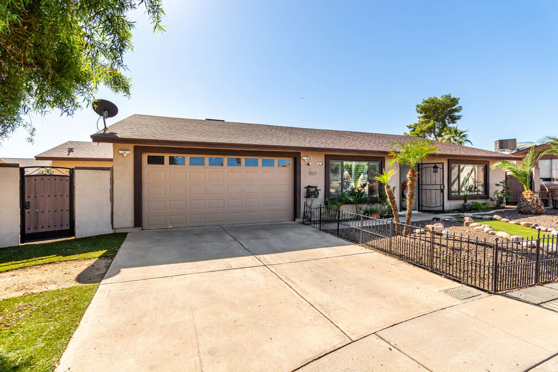 10 of 34. The attached two-car garage and wide driveway provide ample parking for residents and guests while enhancing the home's convenience, functionality, and overall curb appeal in Scottsdale.