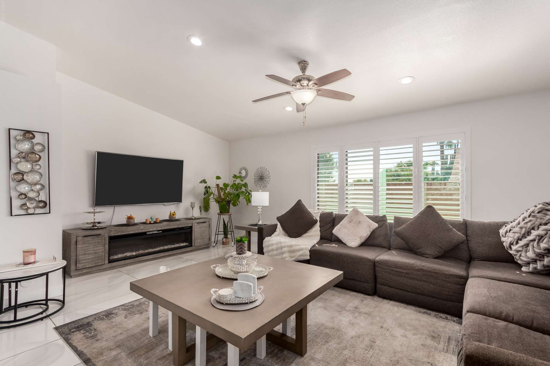 11 of 34. Gather in this spacious family room featuring plantation shutters, recessed lighting, and an open-concept layout that flows into the updated kitchen. Designed for comfortable Scottsdale living and entertaining.