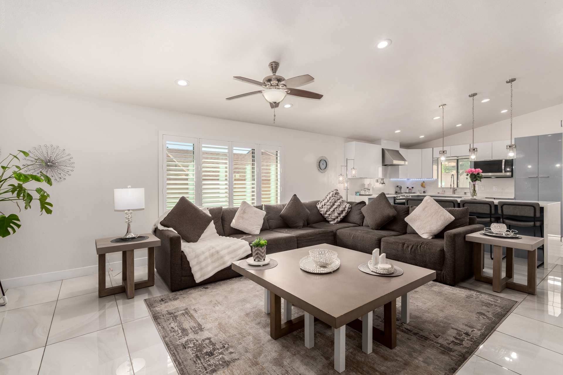 13 of 34. Enjoy a modern open floor plan where the great room and updated kitchen come together beautifully. Spacious living areas, recessed lighting, and stylish finishes make this Scottsdale home ideal for entertaining.