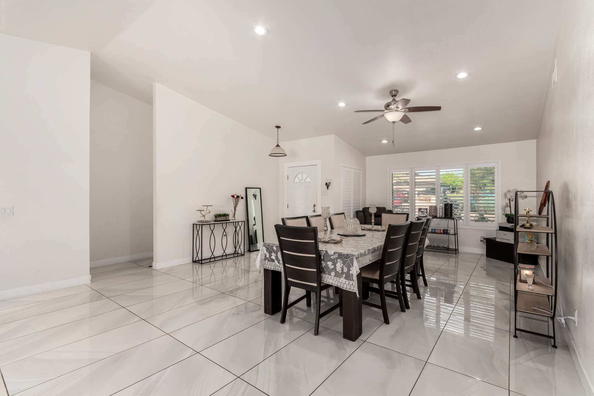 16 of 34. The formal dining area offers generous entertaining space with large windows, modern finishes, and easy flow throughout the home. A versatile gathering space perfect for holidays and family celebrations.