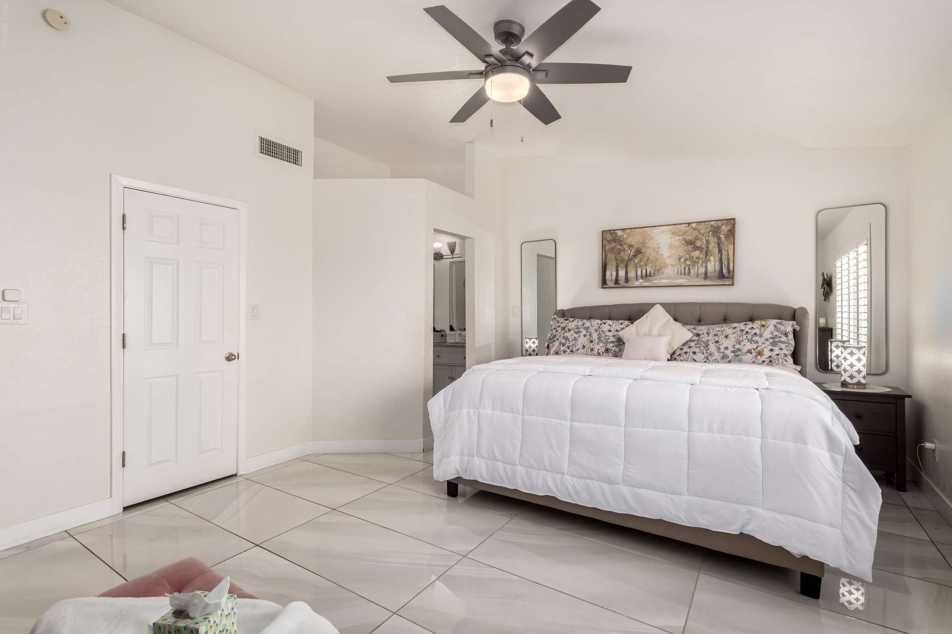 18 of 34. This welcoming primary suite offers generous dimensions, vaulted ceilings, plantation shutters, and easy access to the private ensuite bathroom. A peaceful retreat within this move-in ready Scottsdale home.