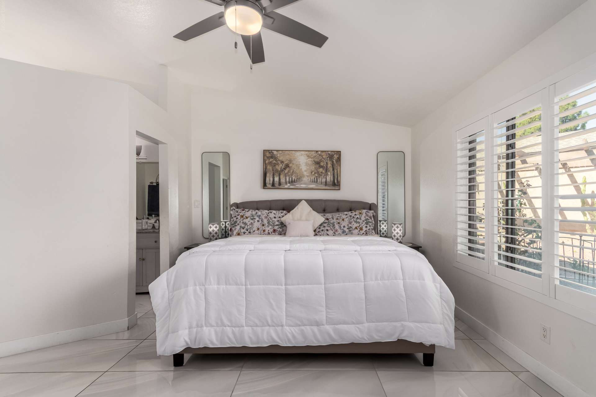 19 of 34. Designed for comfort, the primary bedroom features oversized windows, stylish finishes, tile flooring, and excellent natural light. A relaxing space that complements the home's updated interior.