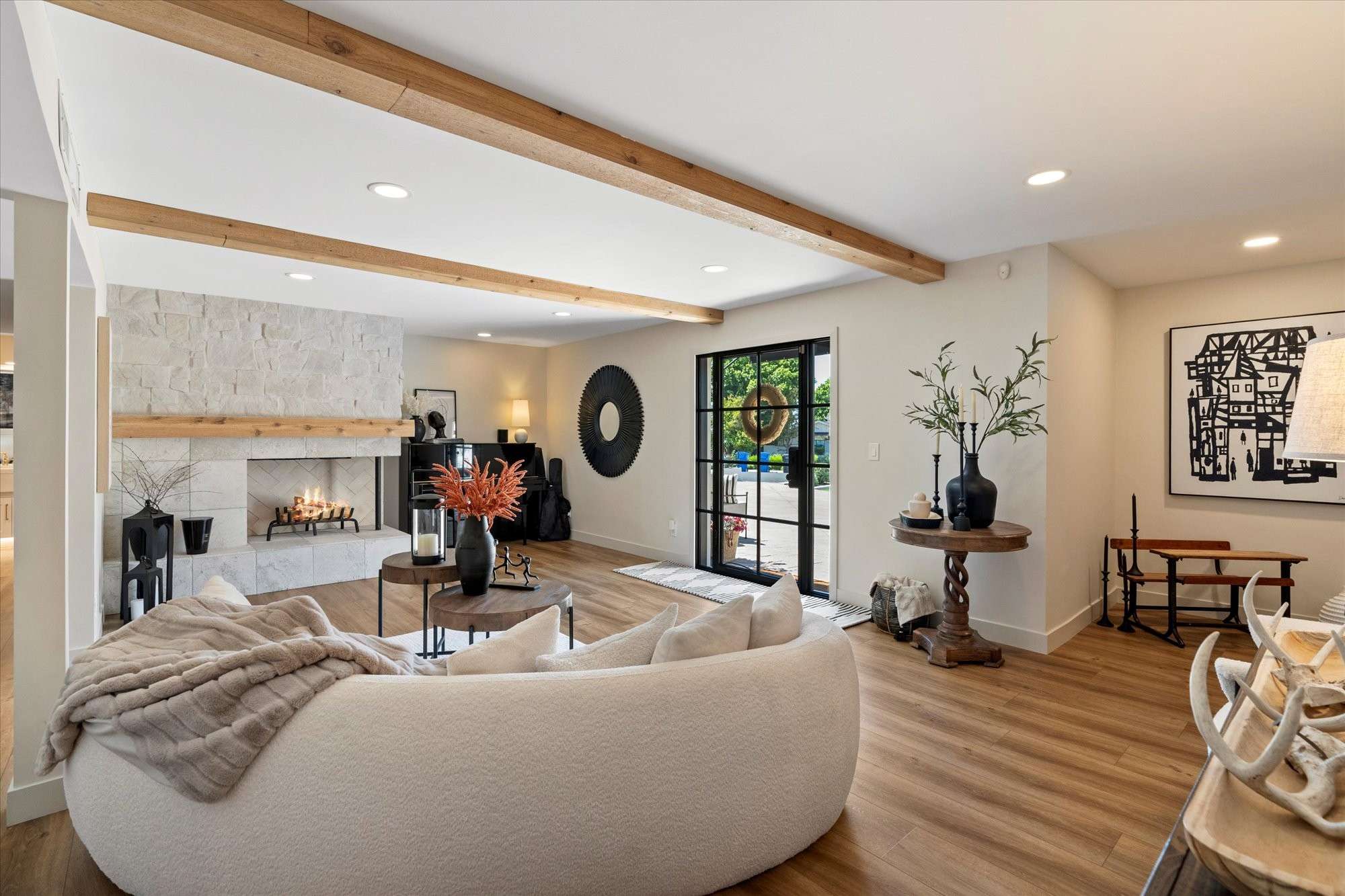 3 of 48. Stylish living area anchored by a custom fireplace, neutral tones, and abundant natural light for comfortable everyday living in Phoenix.