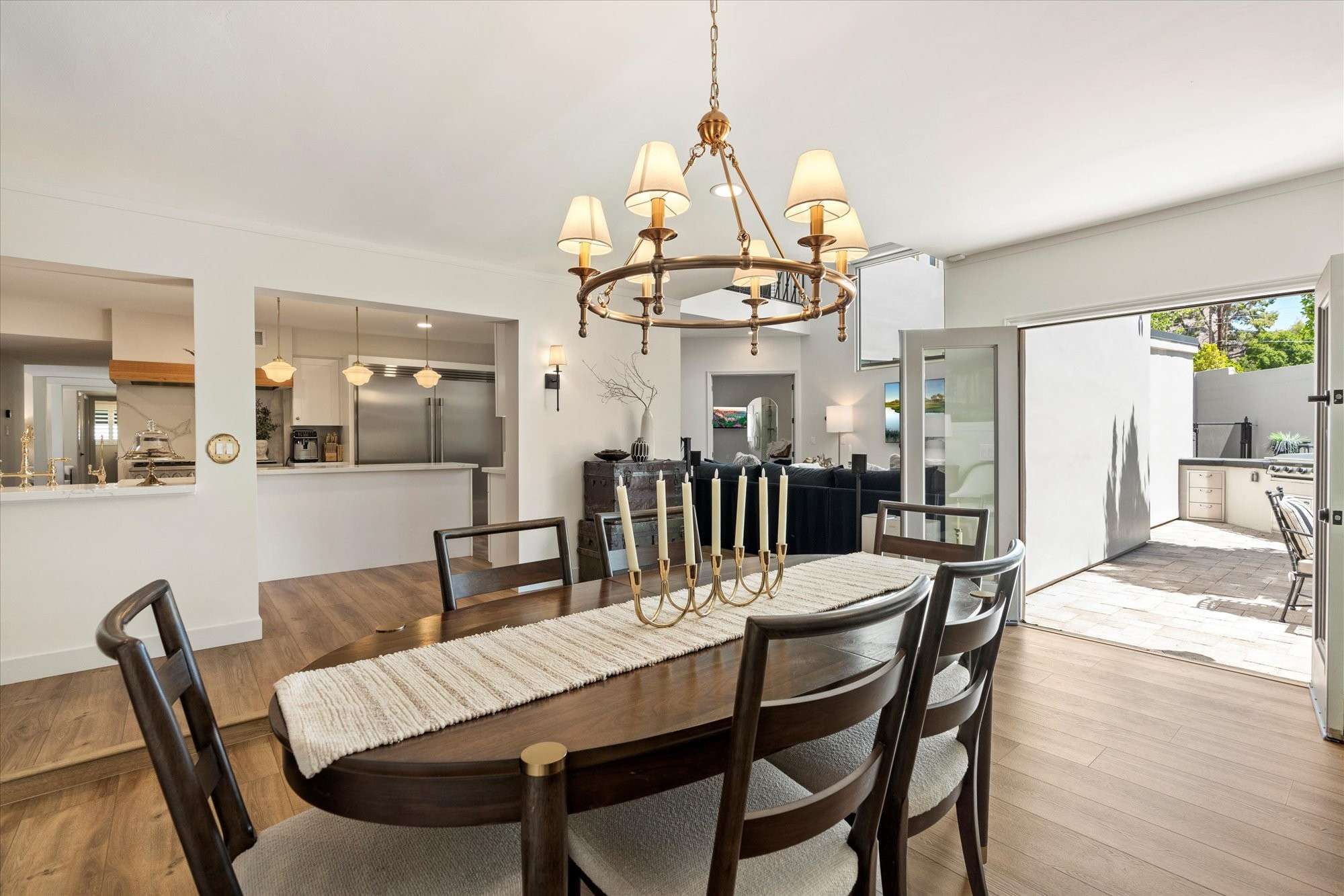 8 of 48. Dining room with French door access to the patio, blending indoor comfort with outdoor entertaining in this Arcadia Proper home.