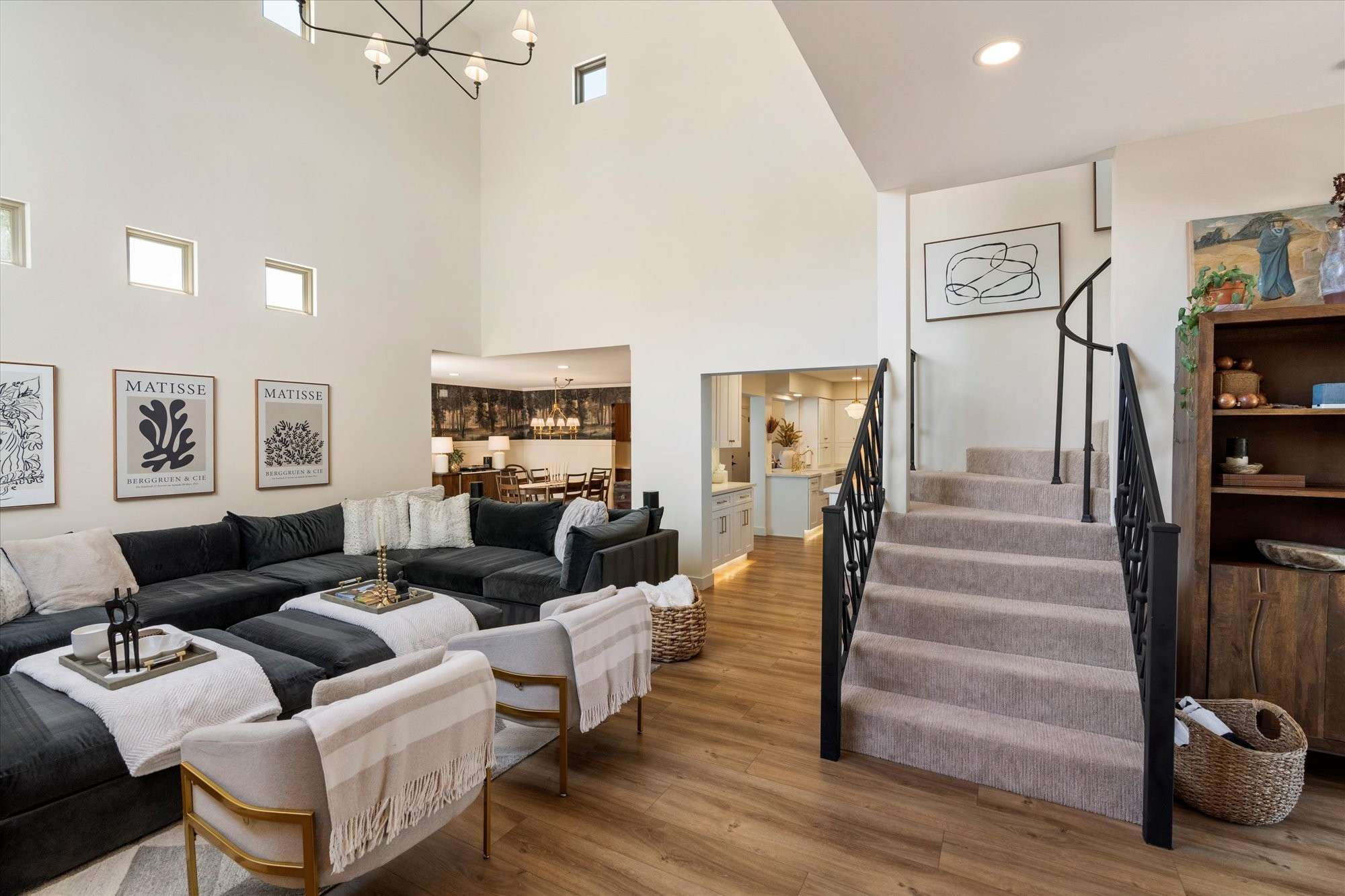 16 of 48. Beautifully designed great room highlighting architectural character, staircase views, and seamless flow to nearby living areas.