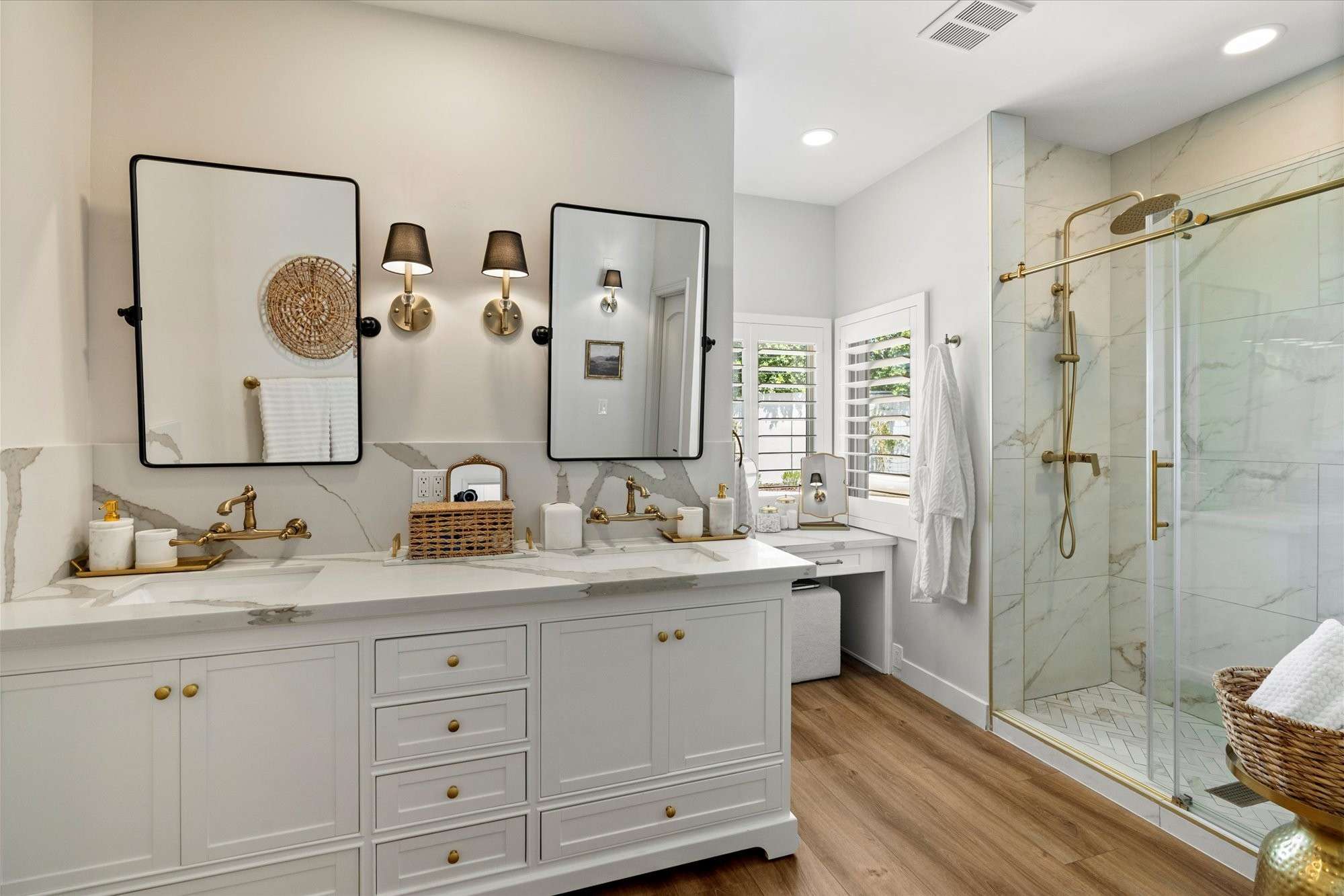 20 of 48. Primary bathroom featuring dual sinks, custom cabinetry, designer lighting, and upscale finishes throughout.