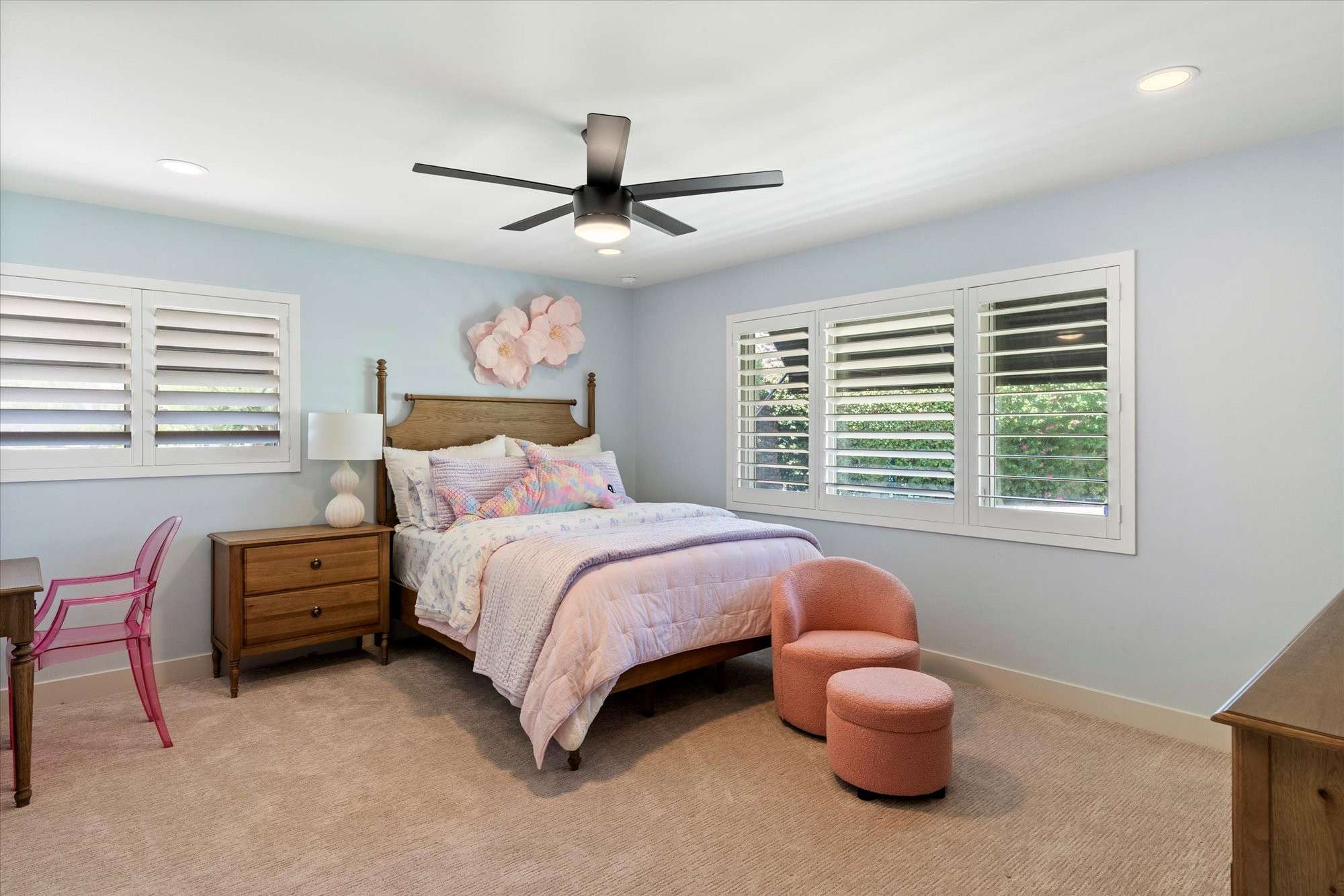 26 of 48. Light-filled guest bedroom with plantation shutters, ceiling fan, and comfortable proportions for overnight guests or everyday use.