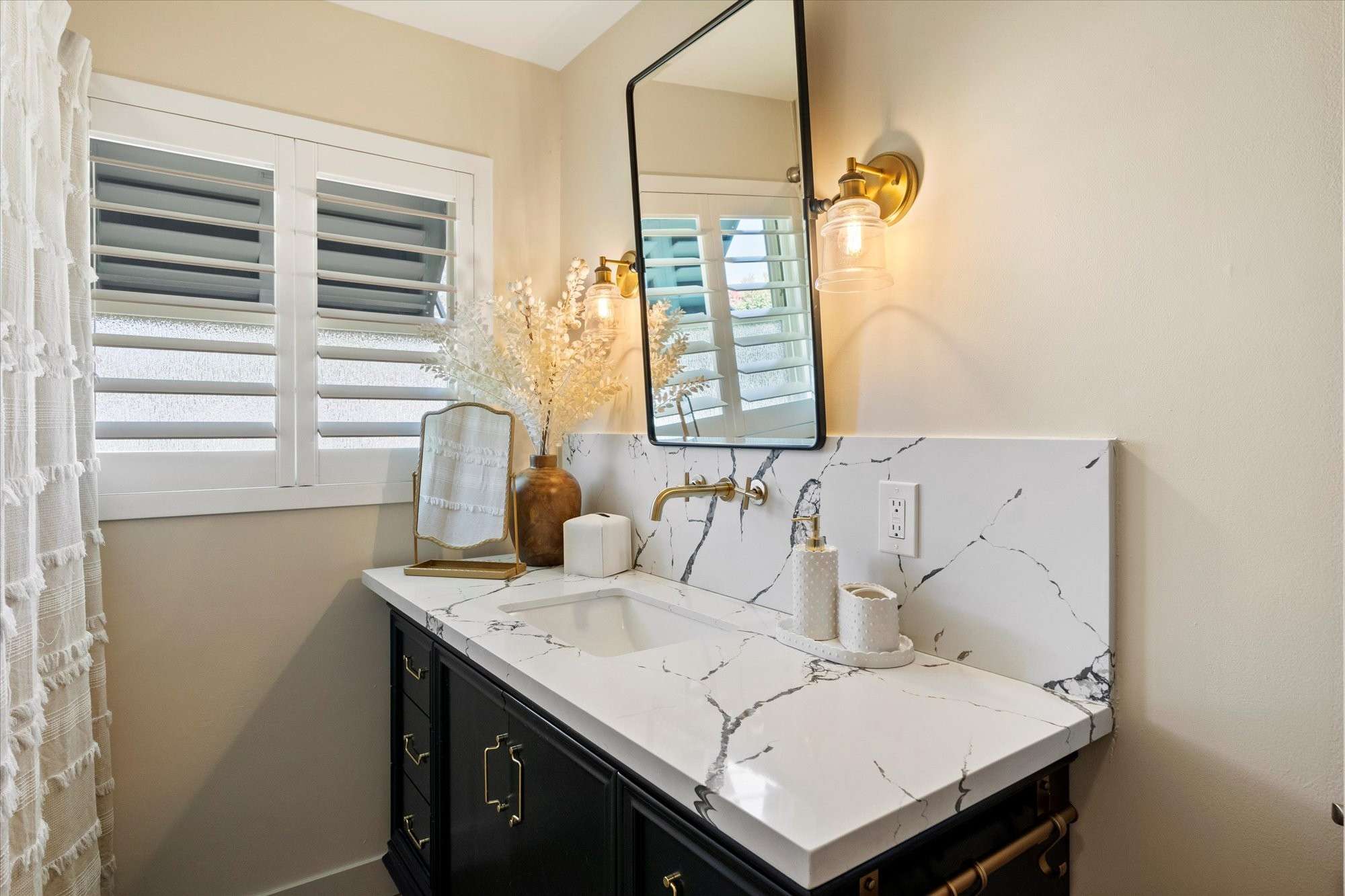 27 of 48. Updated guest bathroom showcasing quartz counters, sleek hardware, and clean-lined cabinetry for a polished, move-in-ready feel.