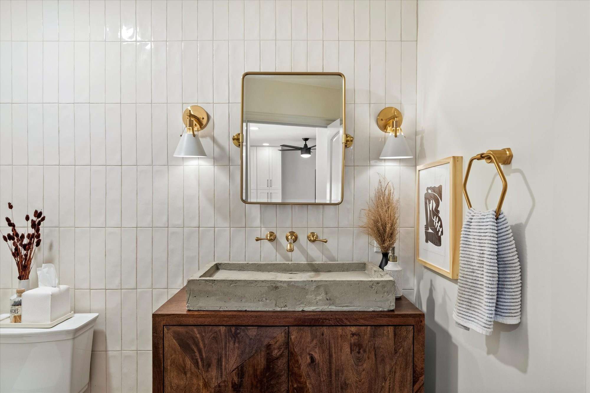 30 of 48. Thoughtfully designed powder room featuring statement vanity, modern lighting, and upscale finishes for guests.