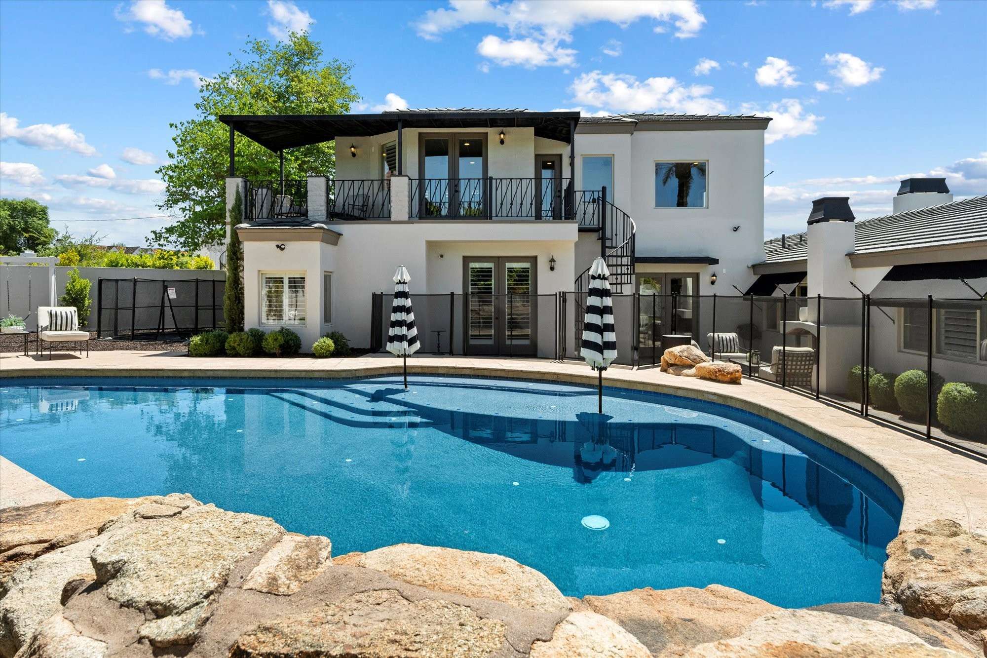 12 of 48. Spacious pool and deck designed for entertaining, relaxation, and enjoying the outdoor lifestyle year-round.